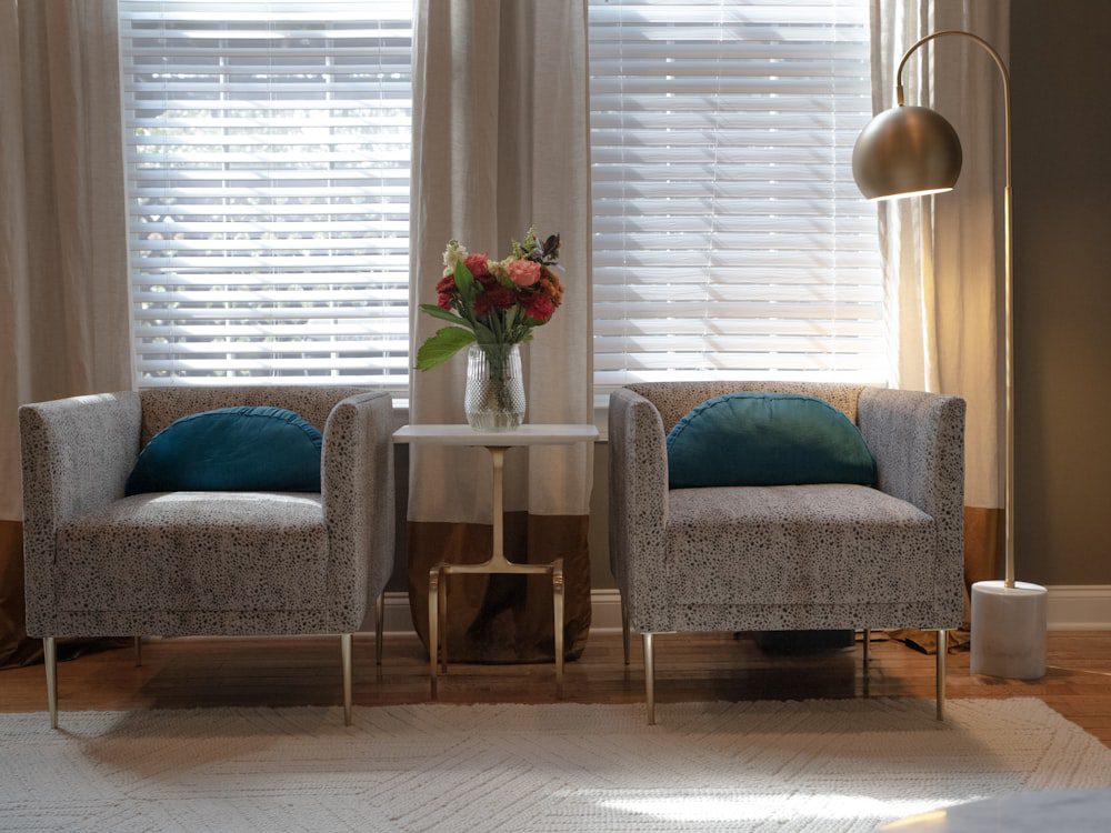 Two comfortable armchairs by a window in a warm, inviting room for couples therapy in NYC